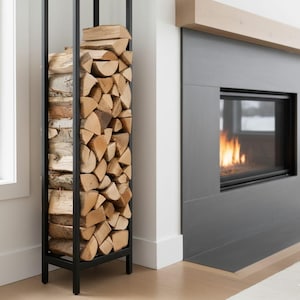 May include: A black metal log store filled with stacked firewood. The rack is rectangular and stands upright. The logs are various sizes and shapes, with a mix of light and dark wood tones. A fireplace with a burning fire is in the background.