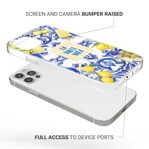 May include: A clear phone case with a colorful Italian-inspired design featuring lemons, flowers, and the text "La Dolce Vita". The case has raised edges to protect the screen and camera.