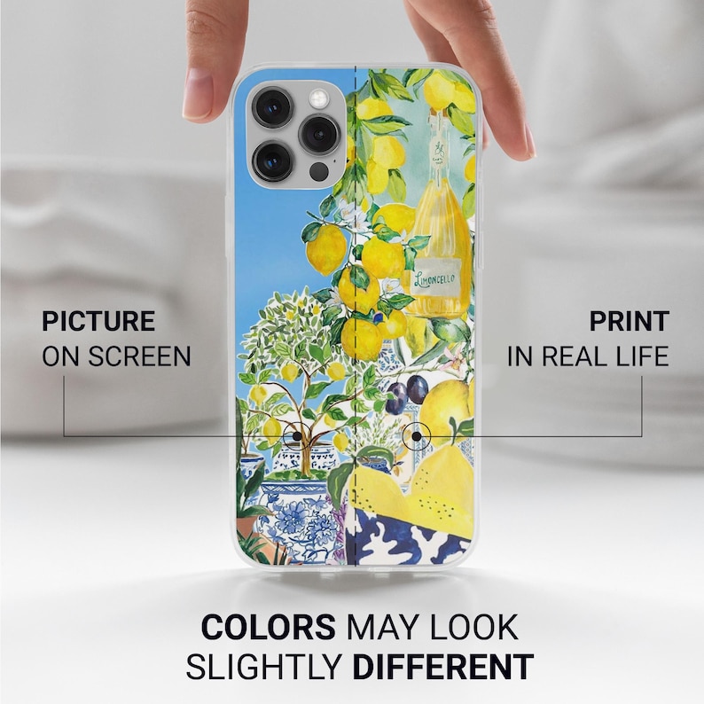 May include: A white iPhone 13 Pro Max phone case with a colorful design featuring lemons, a bottle of limoncello, and blue and white patterned tiles. The text "Limoncello" is visible on the bottle.