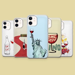 May include: Four different phone cases with a wine theme. The first case has a bottle of wine and a glass of wine with the text "Cin! Cin!" The second case has a red background with a bottle of wine and a glass of wine. The third case has a blue background with a glass of wine and the Statue of Liberty holding the glass. The fourth case has a yellow background with a glass of wine and the text "Time for some Vino".