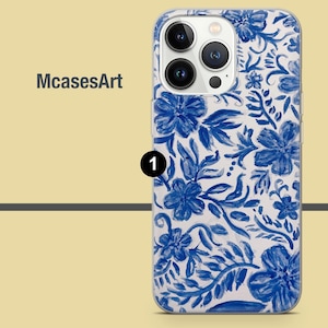 May include: A clear phone case with a blue and white floral design. The case has a raised camera bump and a cutout for the phone's buttons.