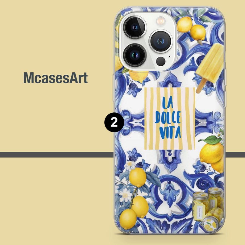 May include: A clear phone case with a blue and white tile pattern. The case features lemons, a popsicle, and the text "La Dolce Vita".