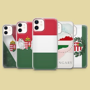 May include: Five phone cases showcasing designs inspired by Hungary. The cases feature the Hungarian flag's red, white, and green stripes, the coat of arms, and map outlines. The cases are in a row, with clear protective covers.