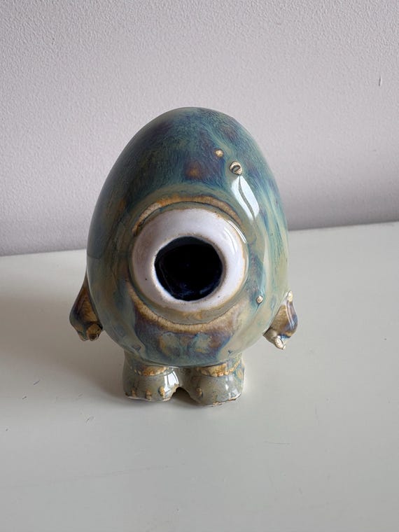 Hand-thrown stoneware monster creatures with real sculptural personality — the kind of thing you keep on your desk and explain to every visitor.