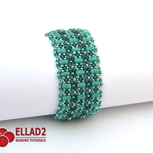 May include: A turquoise and silver beaded bracelet with a woven pattern. The bracelet is made with small, round beads and rectangular beads.