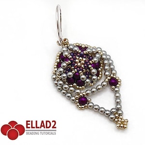 Könnte beinhalten: Ein silberner und goldener Perlenohrring mit einem violetten Zentrum. Der Ohrring ist tropfenförmig und hat einen silbernen Haken.