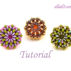 May include: Three beaded flower rings in different colors. The first ring is purple and green, the second is orange and brown, and the third is green and iridescent.