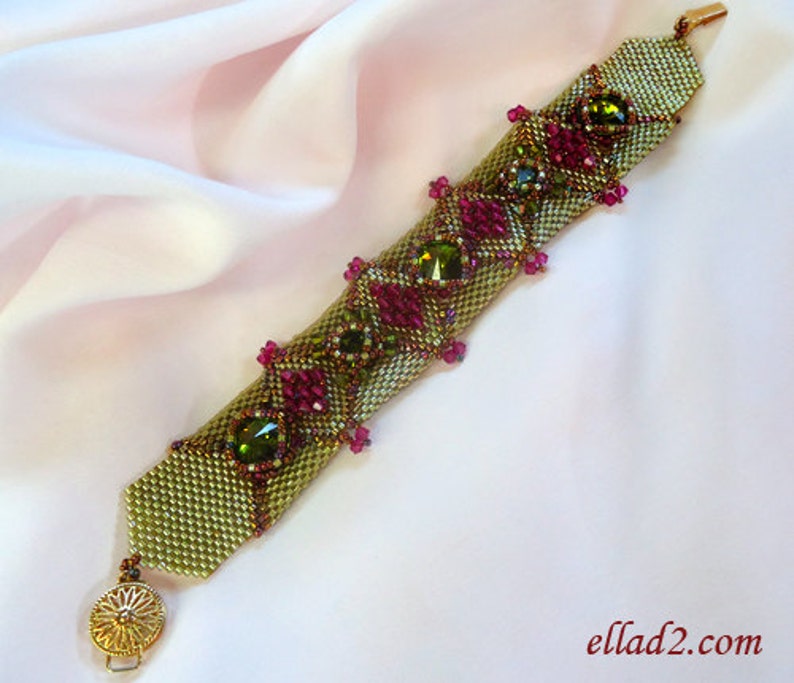 May include: A green and pink beaded bracelet with gold accents and a clasp. The bracelet is made with small seed beads and features larger green and pink beads.