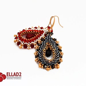 May include: A pair of beaded earrings in a teardrop shape. One earring is red, white, and gold, and the other is black, silver, and gold. Both earrings feature a crystal in the centre.