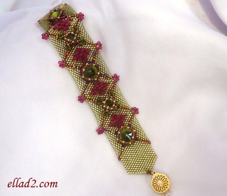 May include: A gold and green beaded bracelet with pink and green accents. The bracelet has a gold clasp.