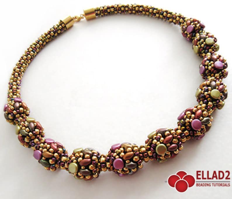 May include: A gold and brown beaded necklace with a series of round, multi-colored beads. The beads are made of small, faceted beads in shades of gold, brown, and purple.