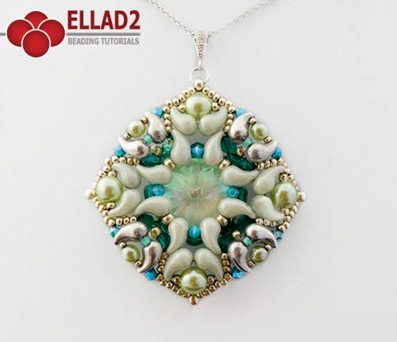 May include: A square pendant with a green and white beaded design. The pendant is made with seed beads and features a central green crystal.