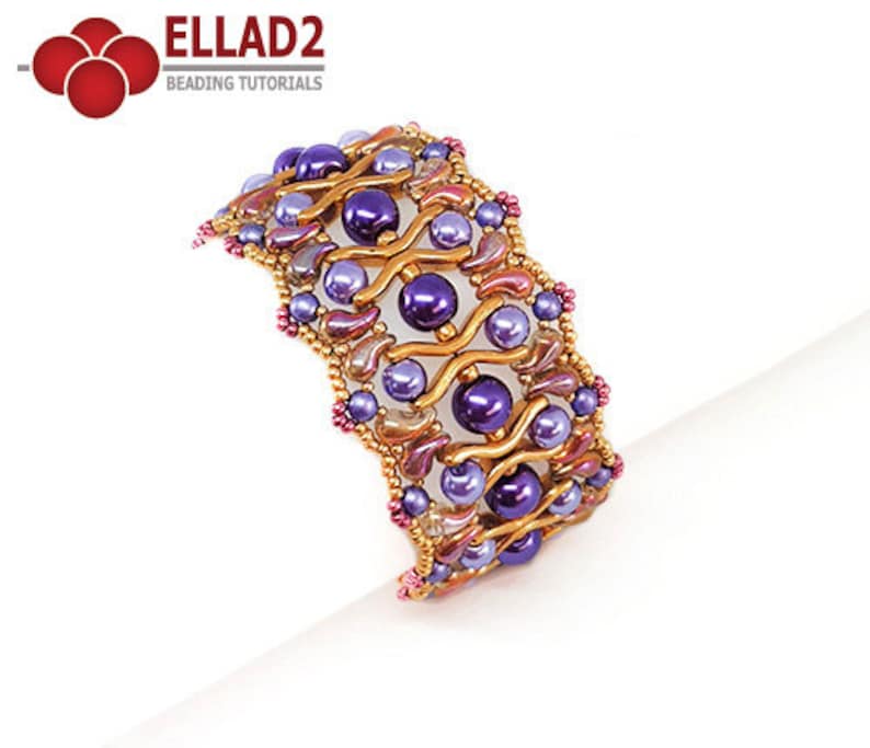 May include: A gold, purple, and pink beaded bracelet with a wavy design. The bracelet is made with small seed beads and larger round beads.