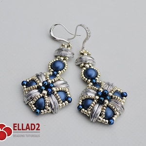 May include: A pair of handmade dangle earrings. The earrings feature a silver-colored metal design with woven details, accented with navy blue beads. The earrings have a hook closure and are designed with a floral pattern.