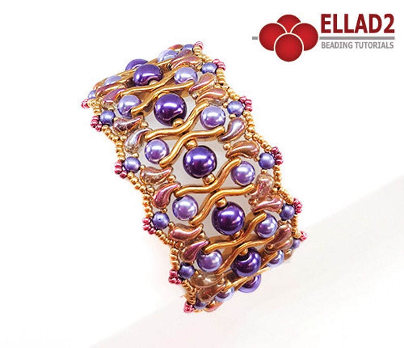 May include: A gold and purple beaded bracelet with a wavy design. The bracelet is made with small seed beads and larger round beads.