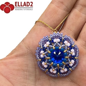 May include: A blue and purple beaded pendant with a large blue gemstone in the center, hanging from a gold chain. The pendant is in the shape of a flower with a white center.