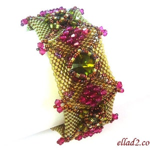 May include: A gold and green beaded bracelet with pink and green crystals. The bracelet is made with a square pattern and has a unique design.