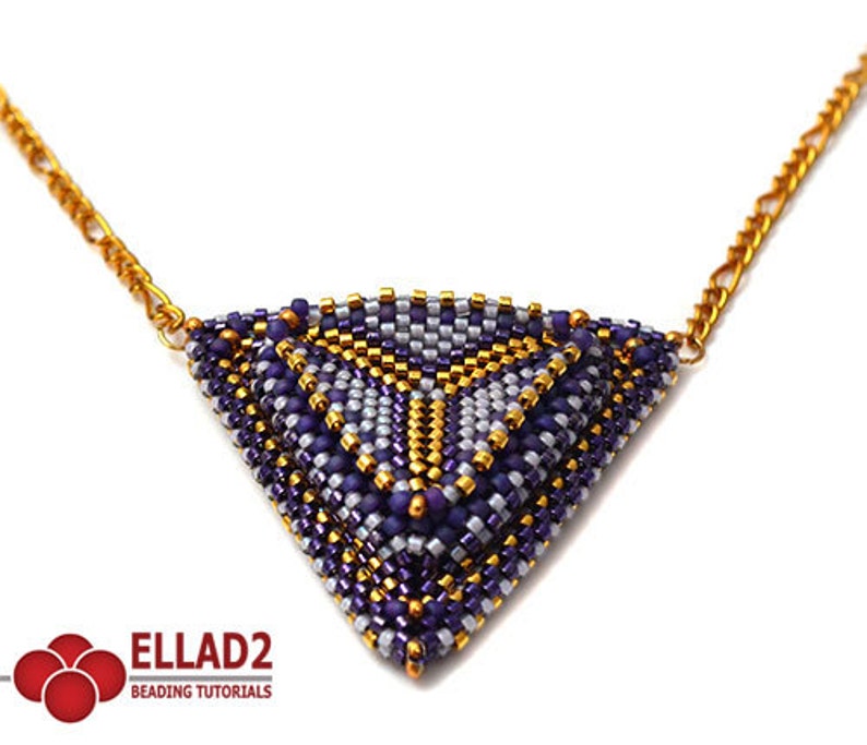 May include: A triangular beaded necklace with a geometric pattern in shades of purple, gold, and silver. The necklace is attached to a gold chain.