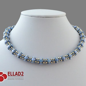 May include: A delicate blue and gold beaded necklace with a twisted design. The necklace is made with small, round beads and is approximately 16 inches long.