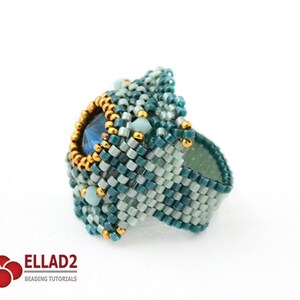 May include: A teal and light blue beaded ring with a large blue gemstone in the center. The ring is surrounded by gold beads.