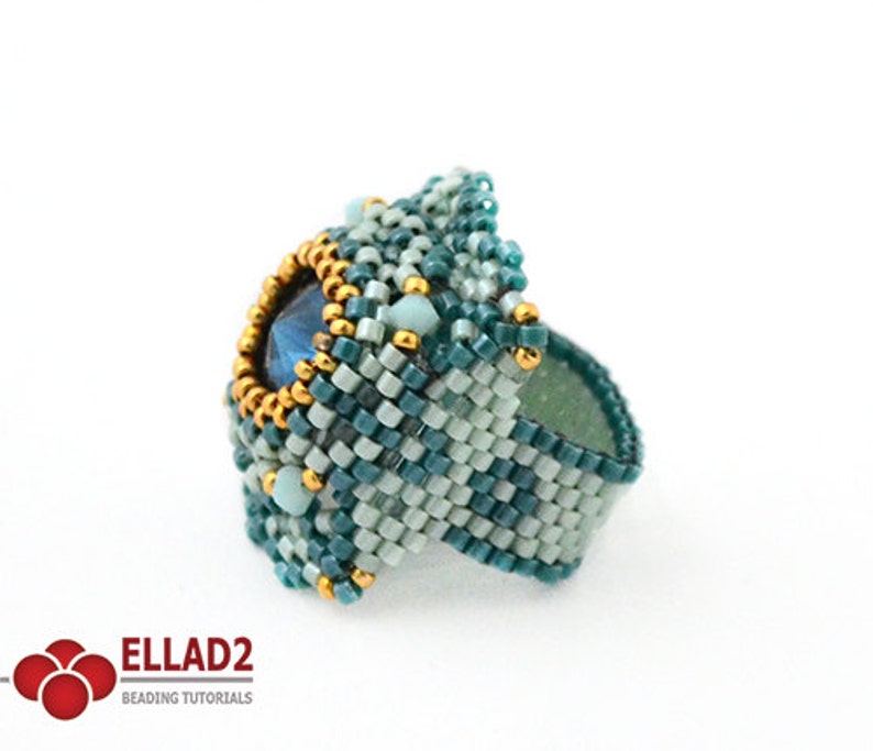 May include: A teal and light blue beaded ring with a large blue gemstone in the center. The ring is surrounded by gold beads.