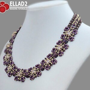 May include: A purple and gold beaded necklace with a geometric design. The necklace features a series of square-shaped beads with a central, light pink bead in each square.
