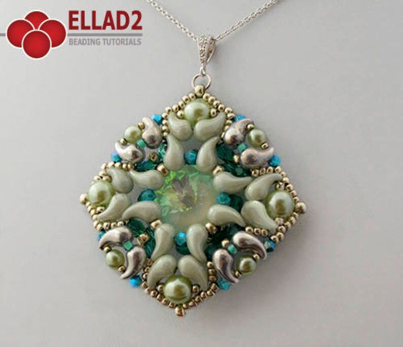 May include: A silver chain necklace with a green and silver beaded pendant. The pendant is a square shape with a geometric design. The beads are in shades of green, silver, and white.
