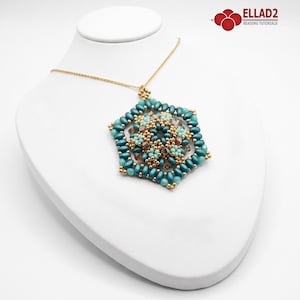 May include: A hexagonal pendant necklace featuring teal, light blue, and bronze beads arranged in a geometric pattern. The pendant is suspended from a thin gold-tone chain. The design incorporates small round beads and elongated oval beads.