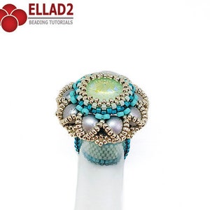 May include: A beaded ring with a light green iridescent stone in the center, surrounded by silver and turquoise beads. The ring is on a white background.