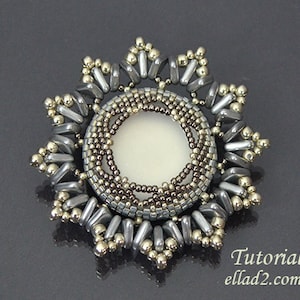 May include: A silver and gray beaded sunburst pendant with a white center. The pendant is made with seed beads and has a geometric design. Tutorial: ellad2.com