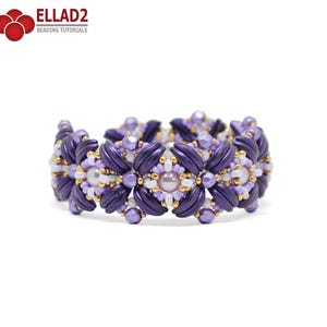 May include: A purple and white beaded bracelet with a floral design. The bracelet is made with small seed beads and larger pearl-like beads.