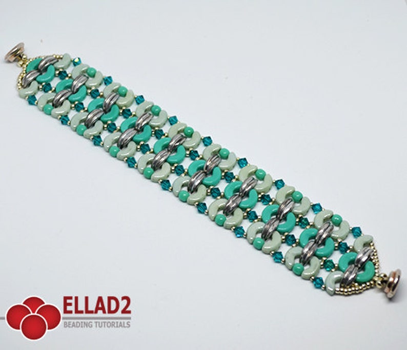 May include: A turquoise and white beaded bracelet with silver accents. The bracelet is made with small, round beads and has a clasp closure.