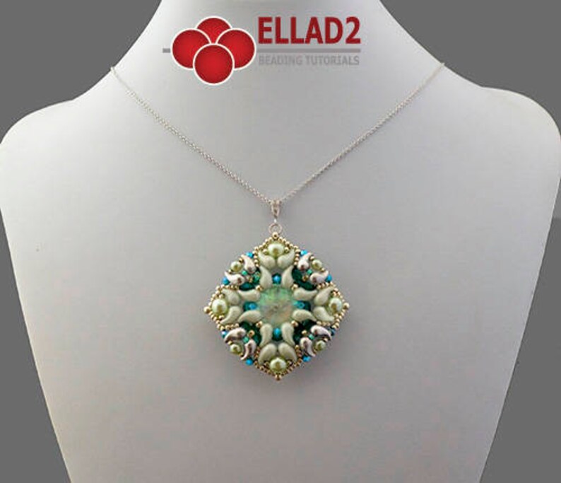 May include: A silver chain necklace with a green and white beaded pendant. The pendant is a square shape with a geometric design. The text "ELLAD2 BEADING TUTORIALS" is visible at the top of the image.