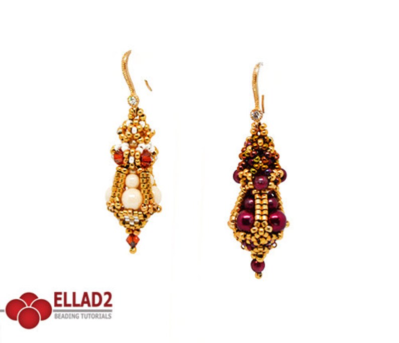 May include: A pair of gold beaded earrings with a teardrop shape. One earring features white and red beads, while the other features burgundy and gold beads.