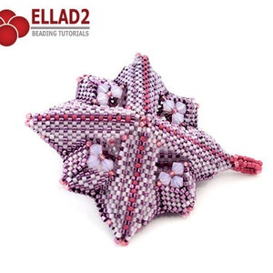 Pode incluir: Uma flor de contas rosa e branca com um design em forma de estrela. A flor &eacute; feita com contas pequenas e tem um padr&atilde;o delicado e intrincado.