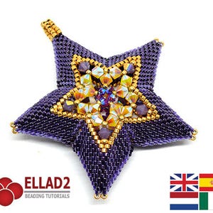 Puede incluir: Un adorno de estrella de cuentas moradas con un centro de cristal dorado e iridiscente. La estrella es un diseño 3D y tiene un bucle en la parte superior para colgar.