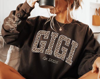 Custom Leopard Gigi Sweatshirt With Kid Name On Sleeve, Personalized Gigi Sweatshirt,Gift For Gigi,Mothers Day Gift,Gigi Est Year Sweatshirt