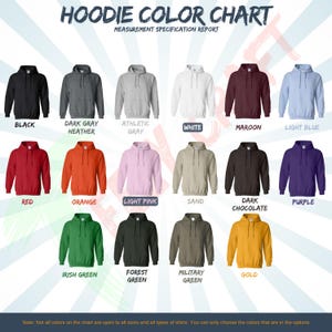 May include: A color chart displaying various hoodie colors, including black, dark gray heather, athletic gray, white, maroon, light blue, red, orange, light pink, sand, dark chocolate, purple, Irish green, forest green, military green, and gold. The chart is labeled "Hoodie Color Chart".