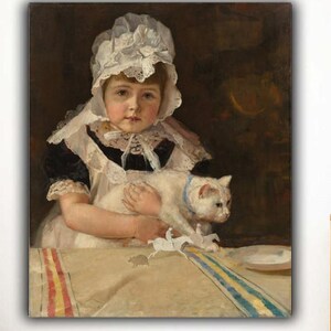 May include: A framed painting depicts a young child in a white bonnet and dress, holding a white cat with a blue collar. The painting has a dark background and is set on a table with a striped cloth. The artwork is displayed on a white wall.