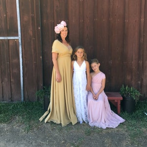 Mother and Daughter in complementary Infinity Wrap Dresses. Girls with chiffon an lace overskirts in gold, blush, and white. Great for Flower girl, junior bridesmaids, mother of the bride
