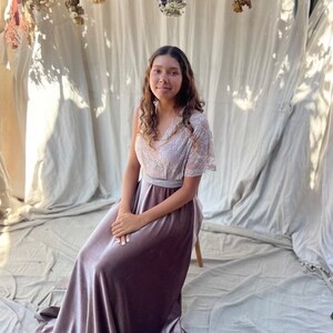 A mauve velvet maxi skirt with a lace bodice and a matching sash.