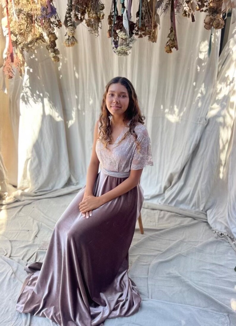 A mauve velvet maxi skirt with a lace bodice and a matching sash.