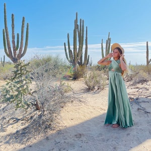 Sage Desert Infinity Wrap Dress with pre-teen girl in sun hat surrounded by Cactus.