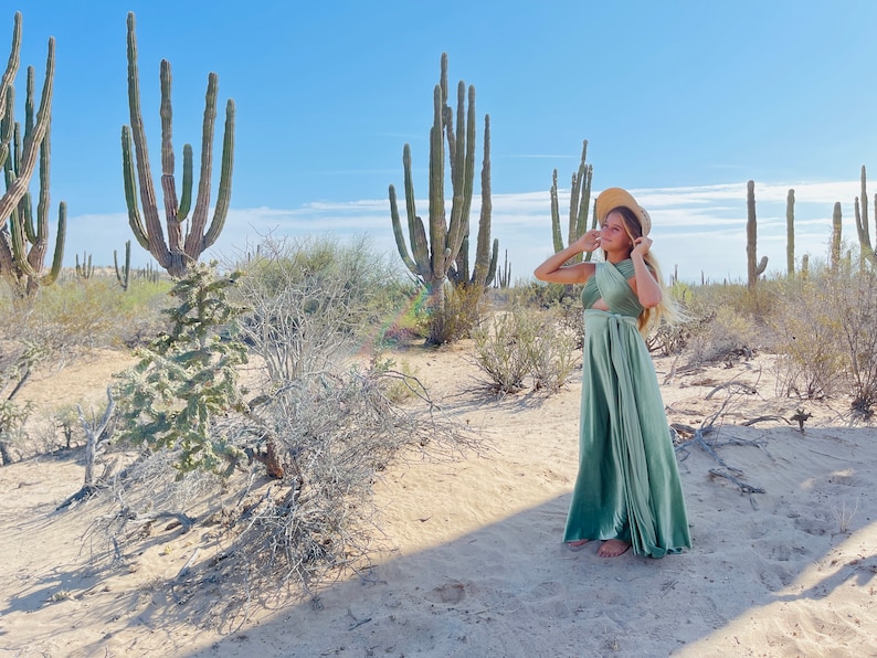 Sage Desert Infinity Wrap Dress with pre-teen girl in sun hat surrounded by Cactus.