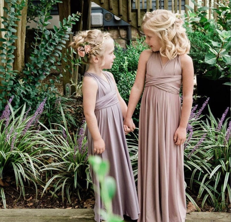 Girl's smileing at each other in Garden in Mauve, dusty lavender long Infinity gown.