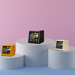 May include: Three digital weather station displays showing the time, date, temperature, and weather conditions. The displays are in black, white, and yellow.