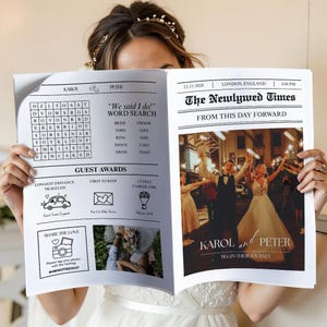 May include: A newspaper-style wedding announcement titled "The Newlywed Times" held by a person. The front page features a photo of a couple, the date, and the names "Karol and Peter." The left page includes a word search and guest award details.