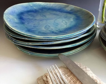 Patterned dinnerware sets, place settings by Leslie Freeman, stoneware dinnerware