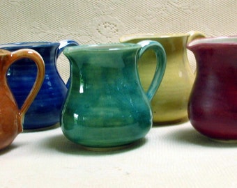 handmade, pottery, stoneware, clay, colorful creamers, mini pitchers,