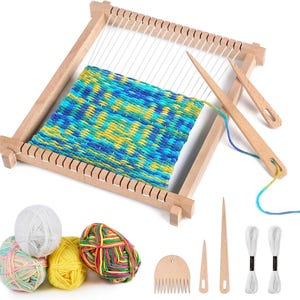 May include: A wooden weaving loom frame with white warp threads and a partially woven blue, green, and yellow textile. Includes two wooden needles, a wooden comb, four balls of yarn in white, yellow, and multicoloured patterns, and two white thread skeins.